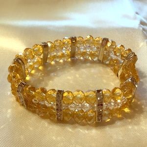 Handmade stretchy gold and white bead;